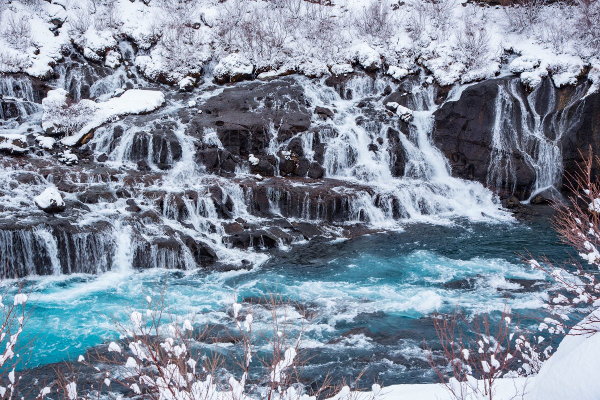 hraunfossar waterfall in winter