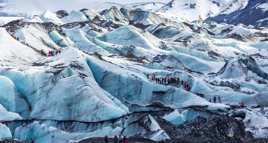 Private,Guide,And,Group,Of,Hiker,Walking,On,Glacier,At